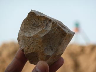 An Oldowan core freshly excavated at Ain Boucherit from which sharp-edged cutting flakes were removed.